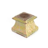 A decorative painted wooden candle sconce, of square waisted form, 15cm high