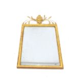 An Antique gilt wall mirror, surmounted by a wheat-ear pediment, having central motif of a head an