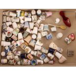 A collection of various porcelain thimbles