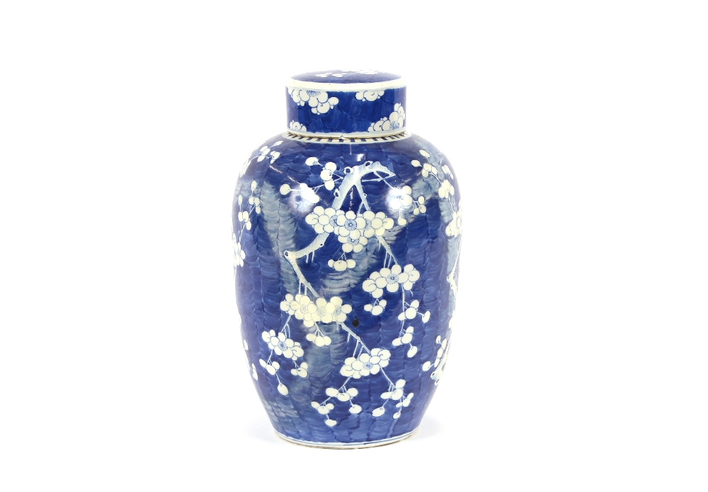 A large Chinese blue and white vase and cover, with Prunus decoration, restored, the lid  AF, 44cm