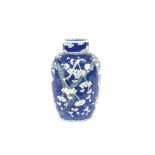 A large Chinese blue and white vase and cover, with Prunus decoration, restored, the lid  AF, 44cm