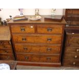 A late Victorian walnut chest, of two short and three long graduated drawers having brass Arts &