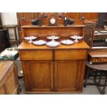 A Victorian mahogany chiffonier, the raised back with scrolled pediment, two drawers above cupboards