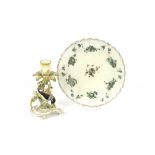 A 19th Century porcelain floral encrusted candlestick, with bird decoration on a scrolled base