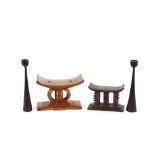 An Ashanti carved striped ebony head rest, with out swept rest of four columns, 15cm; another