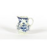 A blue and white baluster bird beak cream jug, having all over floral decoration, 7cm high