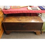 An Antique oak coffer, having square iron lockplate, raised on bracket supports, 115cm wide