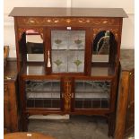 An Art Nouveau mahogany and inlaid display cabinet, in the manner of Shapland &Petter, fitted with