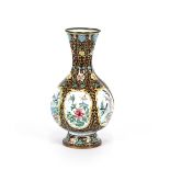 An oriental enamel baluster vase, decorated with panels of birds and foliage, 36cm high
