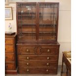 A Victorian mahogany secretaire bookcase, the upper adjustable shelves enclosed by a pair of