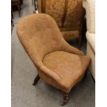 A pair of Victorian mahogany framed tub shaped nursing chairs, raised on turned tapering front