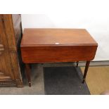 A 19th Century mahogany Pembroke table, fitted single end drawer, raised on turned tapering