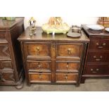 An 18th Century oak chest, of small proportions, fitted one long and four short moulded panelled