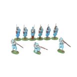 Thirteen painted metal soldiers, some in blue uniform, some in khaki
