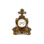 A French gilded metal mantel clock, by Hersant Paris No. 4871, surmounted by an urn finial above a