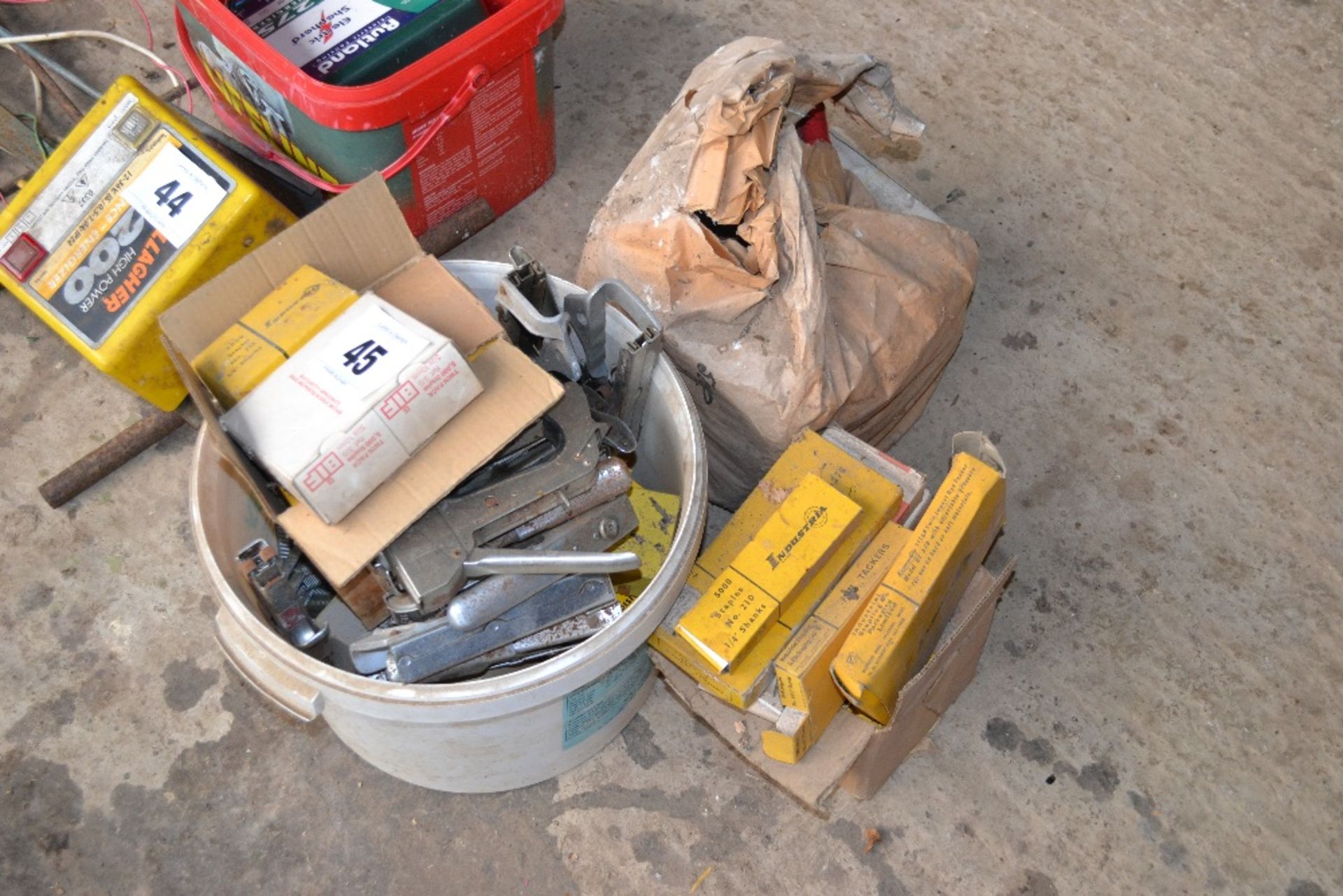 Various staple guns, staples and bag wire ties.