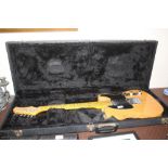 A custom Telecaster with fender strap in hard case