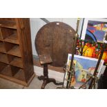 A 19th Century oak tilt top occasional table for r