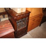 An Old Charm oak and leaded glazed hi-fi cabinet