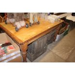 A Victorian pine kitchen table fitted single end d