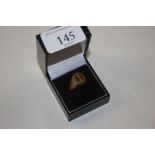 A 9ct olg tiger's eye set signet ring