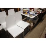 A retro style dining table and a set of four chair