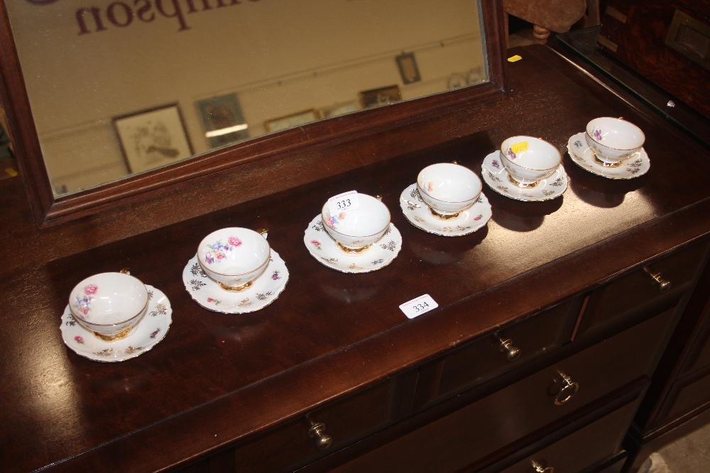 A set of six German floral decorated coffee cups a