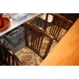 A set of eight mahogany rail back dining chairs to