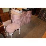 A fabric covered and glass topped dressing table w