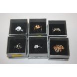 Six 10ct gold plated dress rings