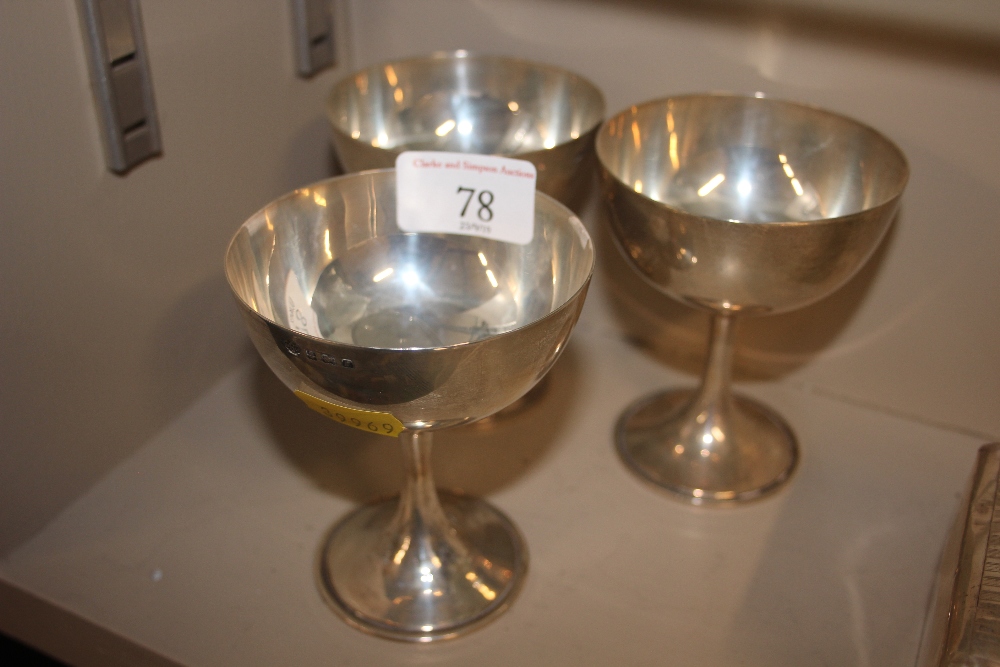 Three silver Champagne saucers