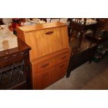 A teak drop front bureau