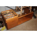 A teak glass topped two tier coffee table