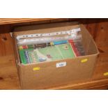 A box containing various England football programm