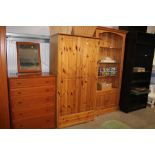 A pine double wardrobe fitted single drawer below