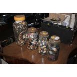 Four jars of buttons