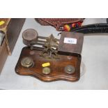 A set of postage scales and weights