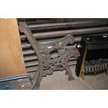 A pair of garden bench end