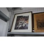 A large framed print depicting geese