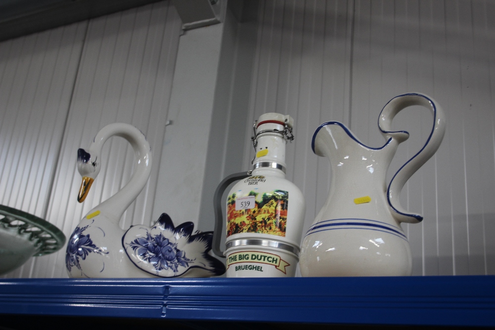 A glazed jug; together with a flask and a swan orn