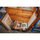 A box of various pictures and prints