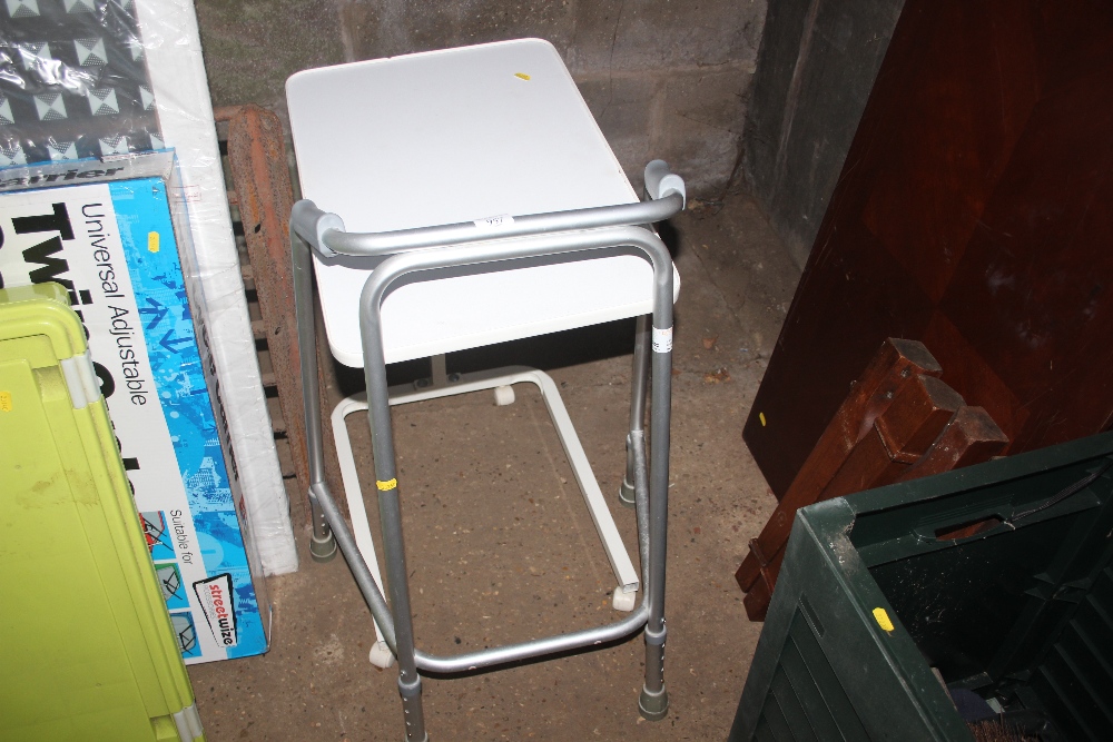 A mobility walker and a bed table