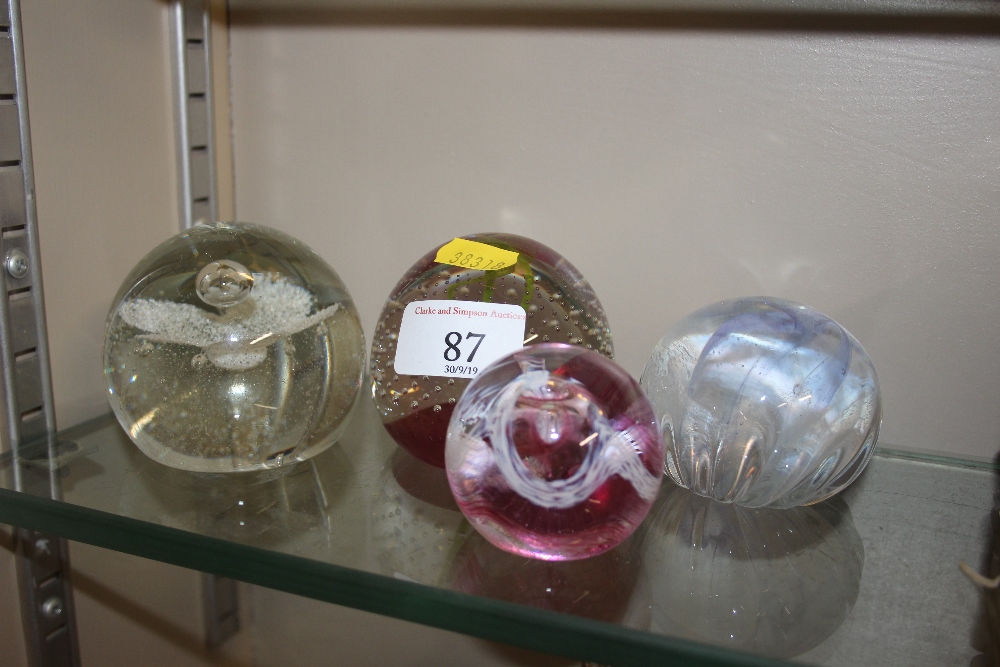 Four various Caithness glass paperweights