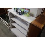 A pine white painted open fronted bookcase