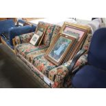 A floral upholstered two seater sofa bed