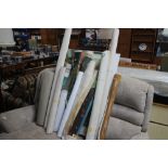 A quantity of unframed pictures etc