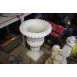 A plastic garden urn