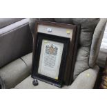 A framed scroll and two framed prints