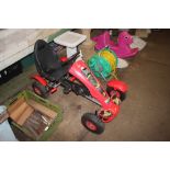 A child's pedal powered go kart