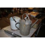 A galvanised watering can and one other